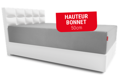 Lit avec un drap-housse BODYGUARD® sur le matelas Boxspring BODYGUARD®. Texte : hauteur bonnet 50cm